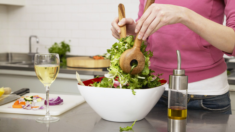 woman making a salad
