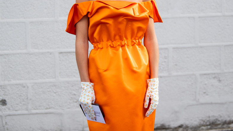 orange dress with floral gloves
