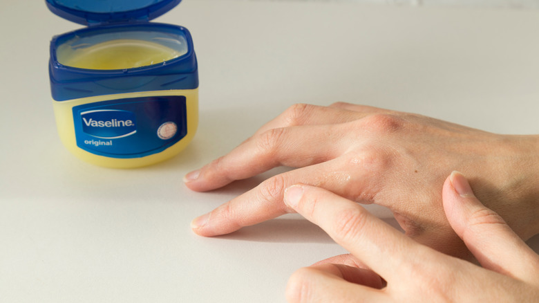 Applying Vaseline to hands