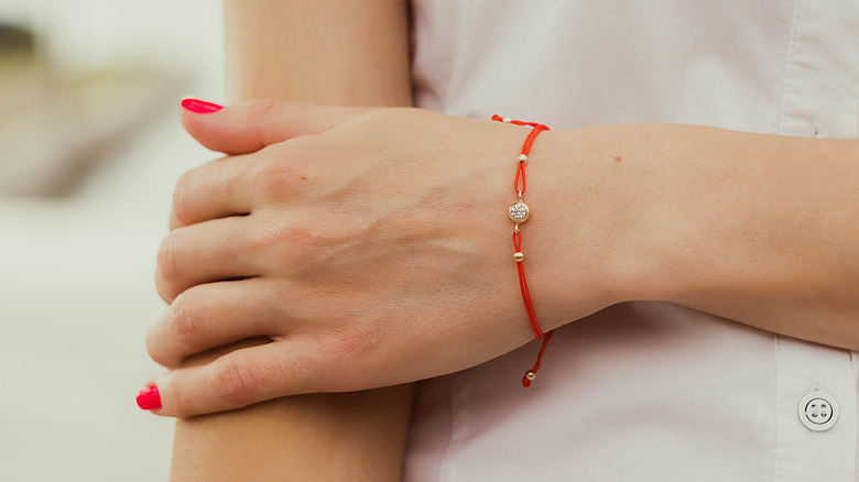 woman wearing bracelet on left hand