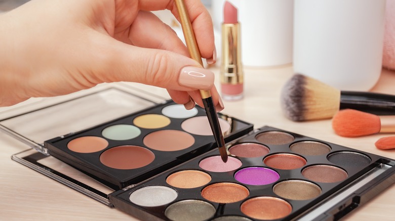 artist picking shimmer eyeshadow