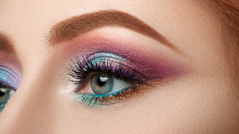 woman with multi-colored eyeshadow