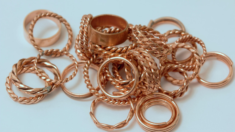 handful of copper rings on a table