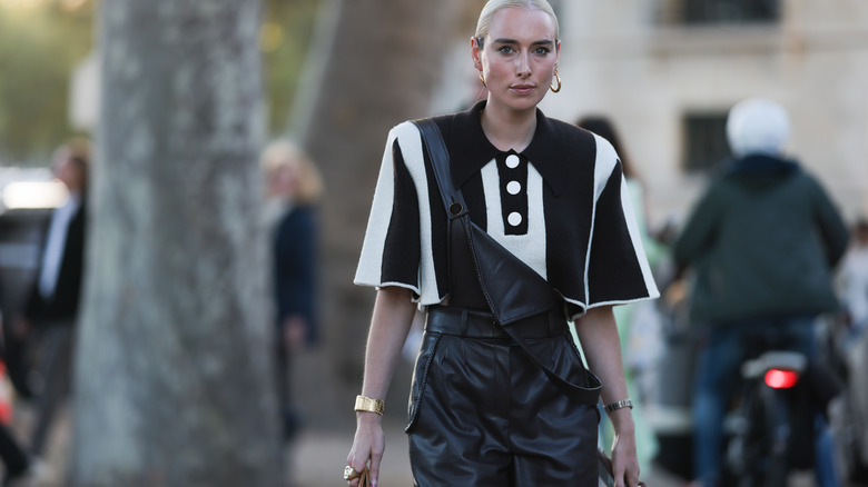 Woman wearing leather overalls
