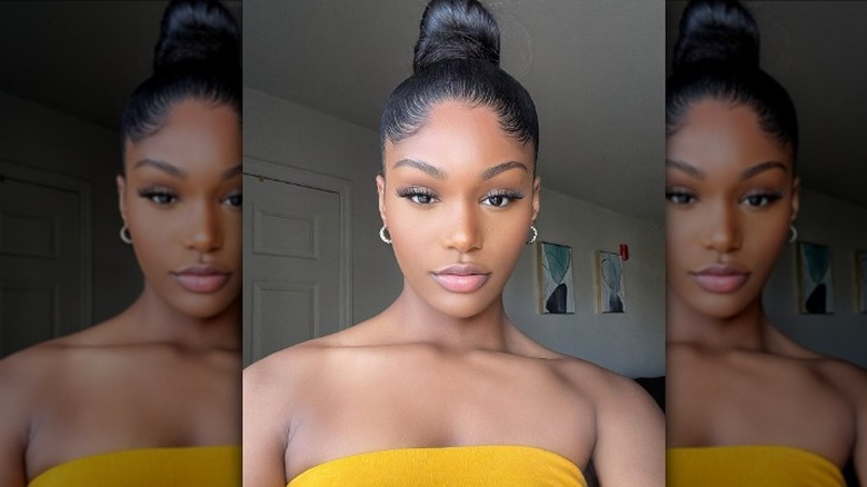 woman with top knot bun