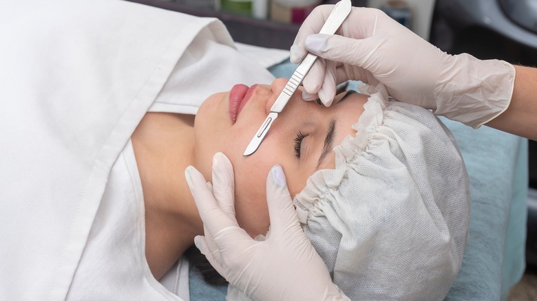 Woman undergoing dermplaning