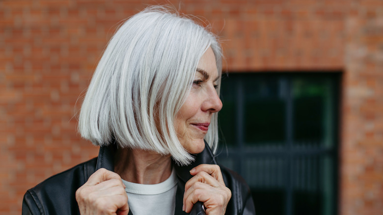 An older woman with grey hair and a chin-length bob posing for a picture