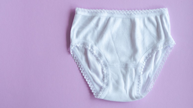 Basic white briefs, purple background