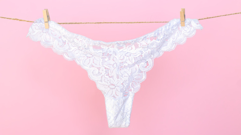 White thong hanging on line