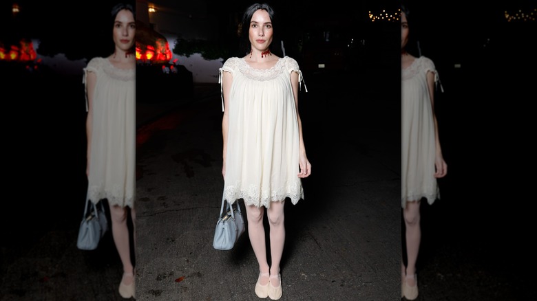 Emma Roberts' 2025 Halloween costume consisting of a white dress and a bloody neck