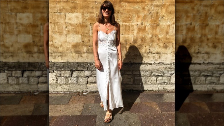 Woman wearing woven slide sandals