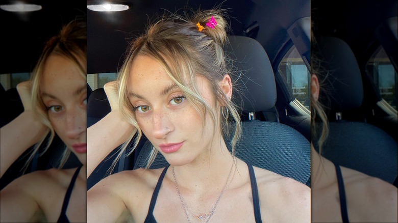 woman wearing claw clips in space buns