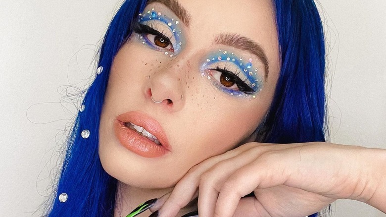 Influencer wears hair and makeup gems