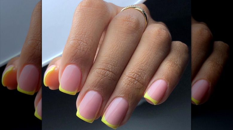 Pastel neon-yellow nail tips