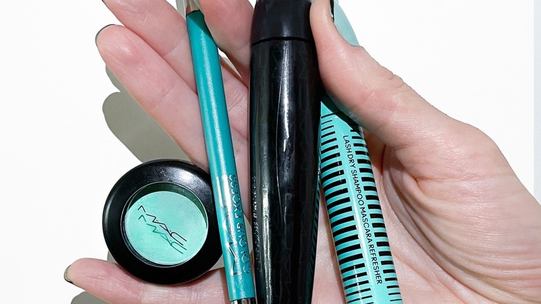 Hand holding MAC products