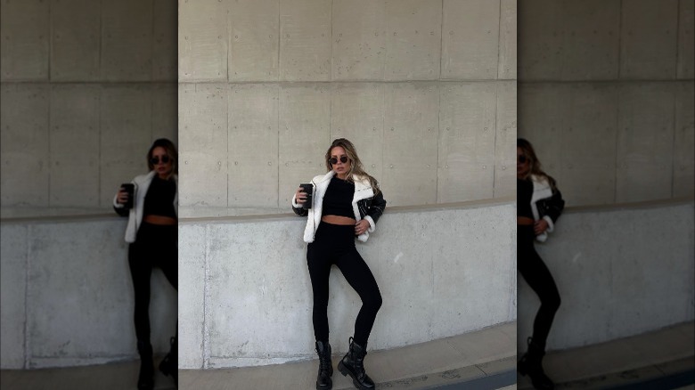 Girl wearing cropped shearling coat.