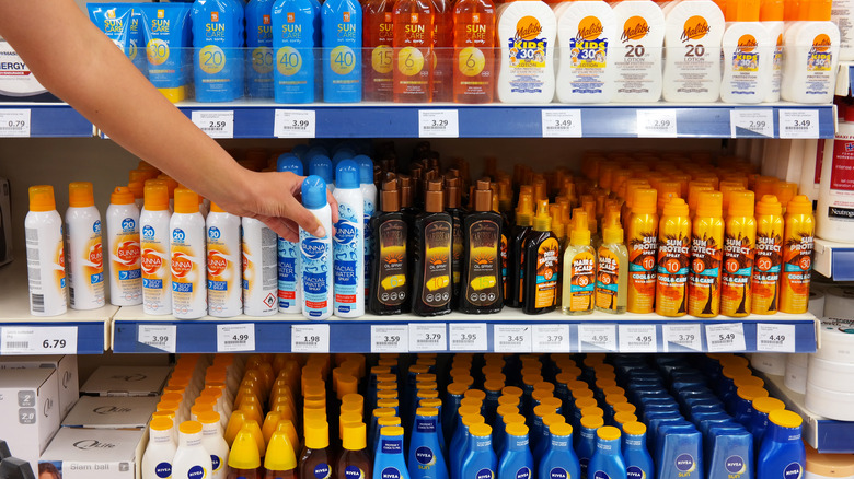 Woman holding sunscreen,SPF