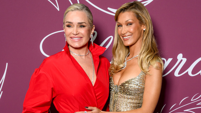 Yolanda Hadid and Bella Hadid posing for a photo at the Chopard Miracle Gala Evening