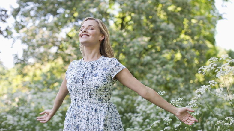 Blissful woman standing outdoors