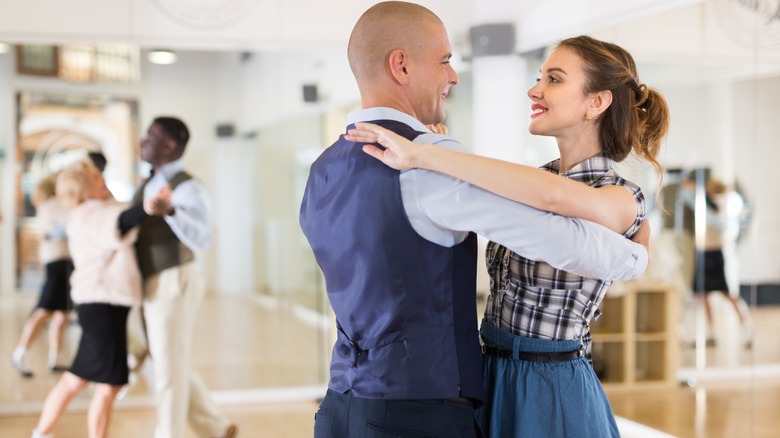 Woman taking ballroom dance lessons