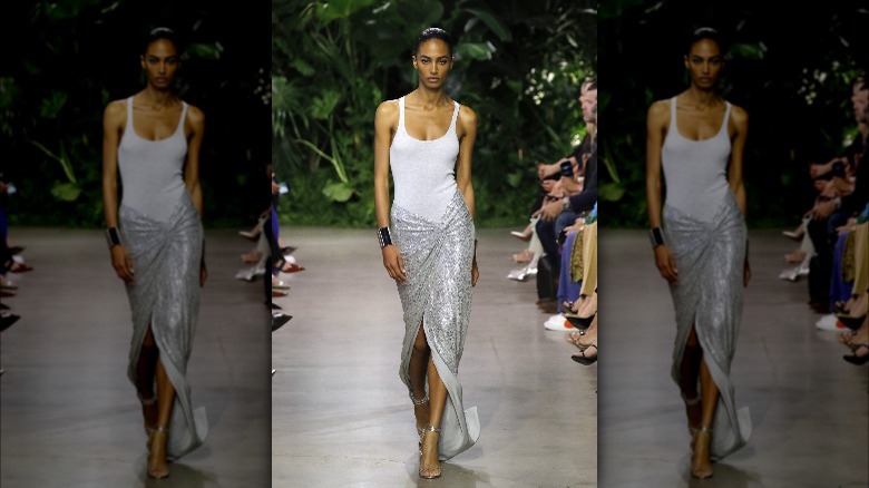 Model in silver skirt