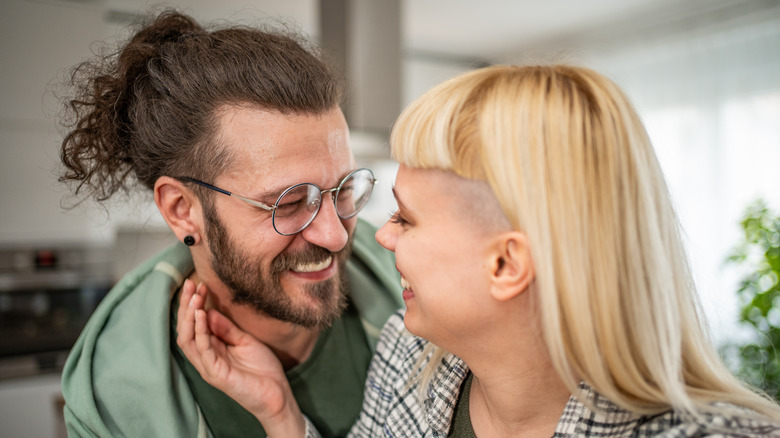 Smiling bearded man with girlfriend