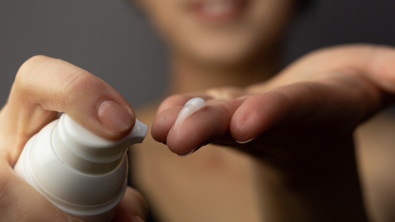 Close up of retinol cream being applied