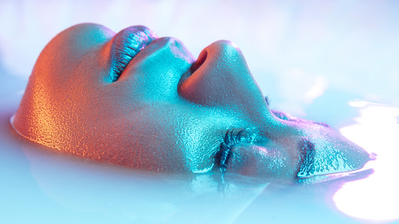 woman's face in milk bath