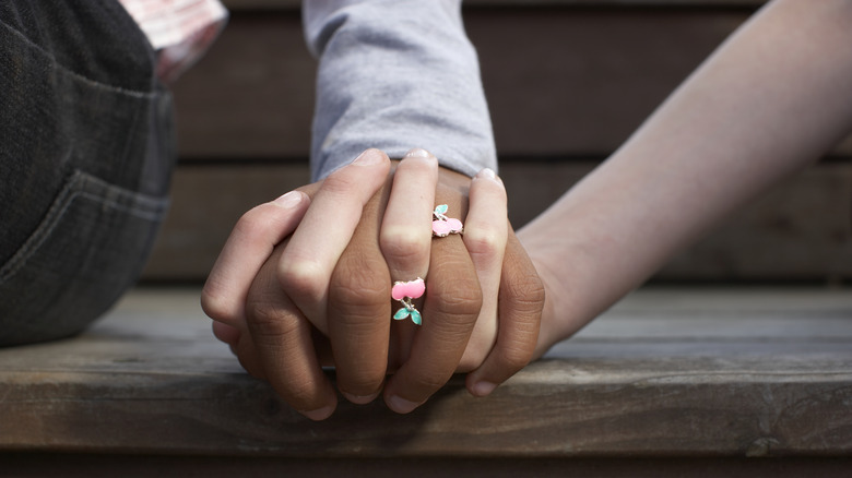 couple holding hands