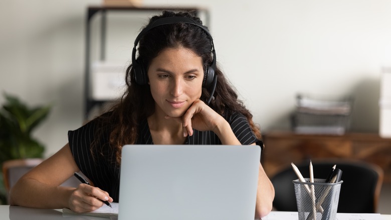 Woman researching on laptop