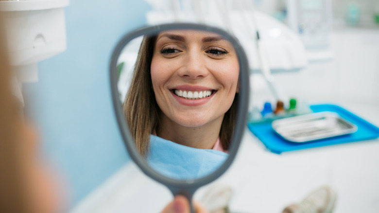 woman smiling in mirror
