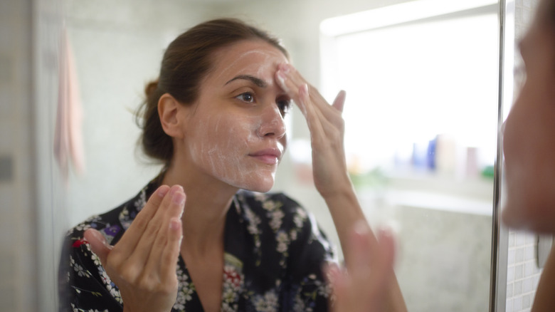 woman washing face