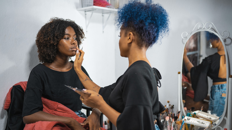 makeup artist working
