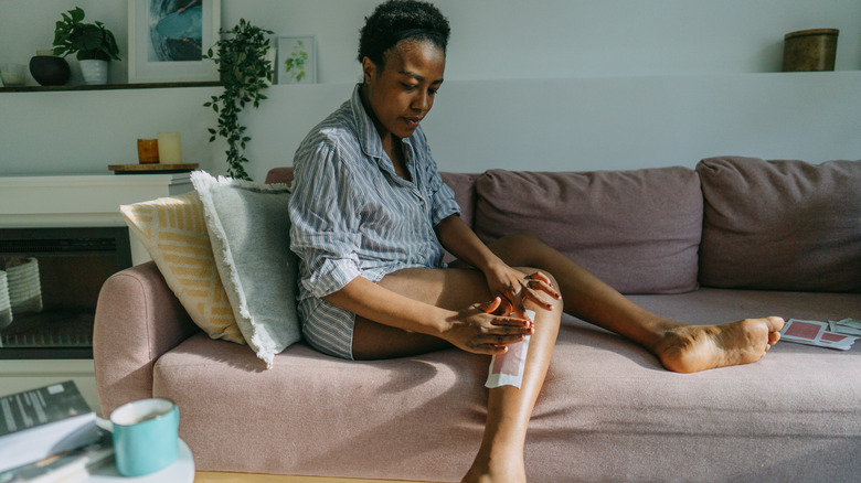 woman waxing legs