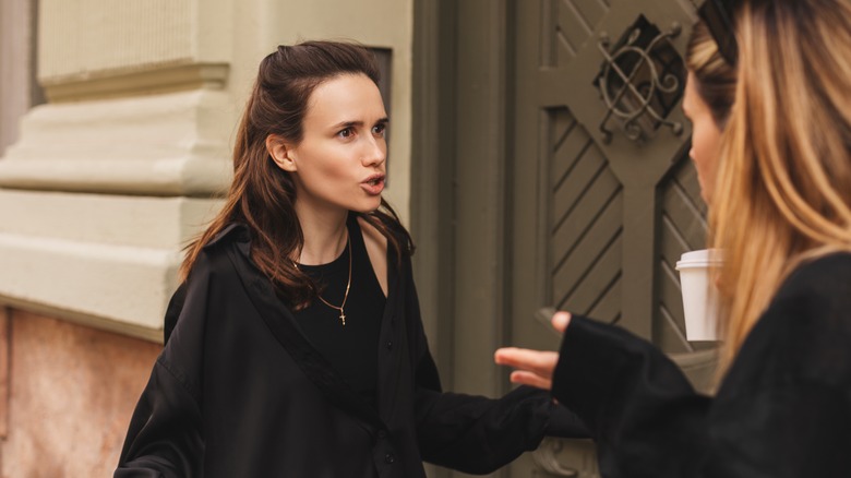 woman talking angrily to friend