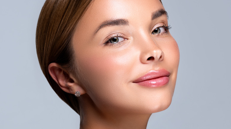 female with plump dewy skin