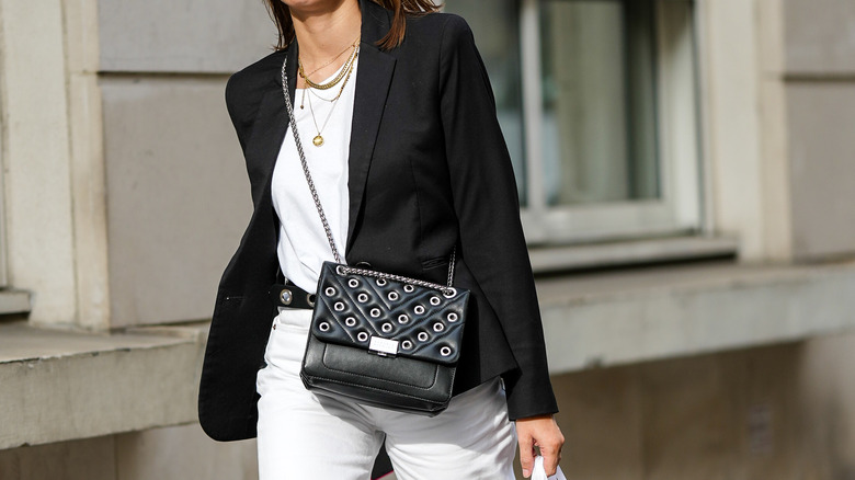 woman wearing white t-shirt with black blazer