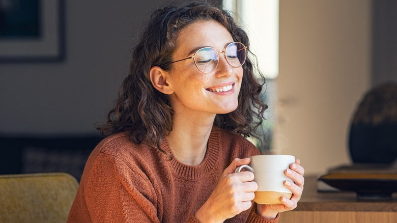 Woman relaxing inside during winter