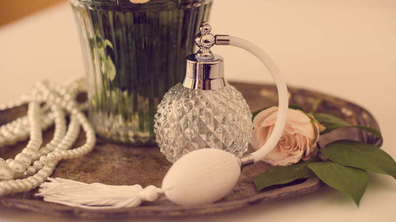 glass perfume bottle with rose