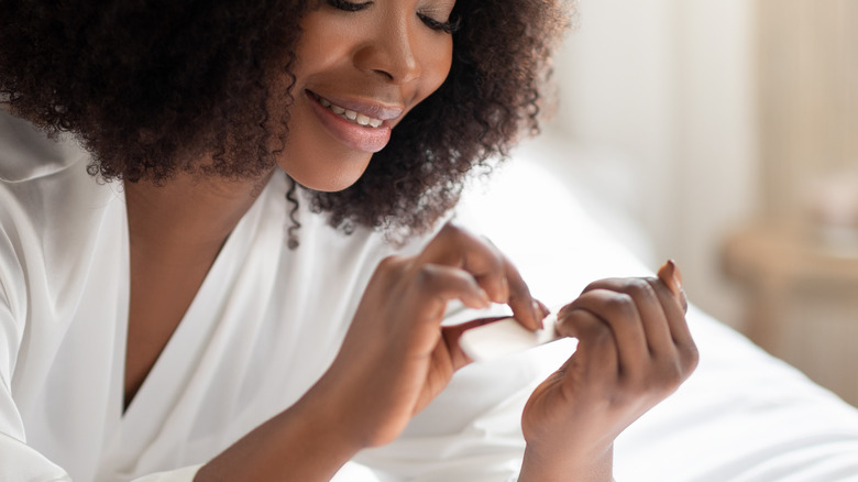 woman filing nails