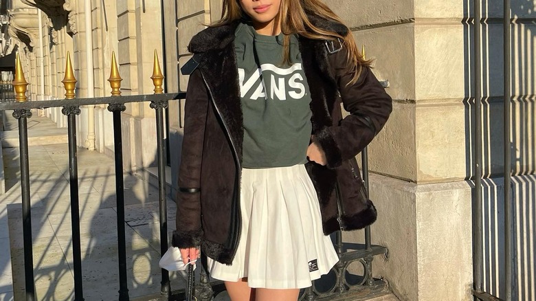  woman in white tennis skirt