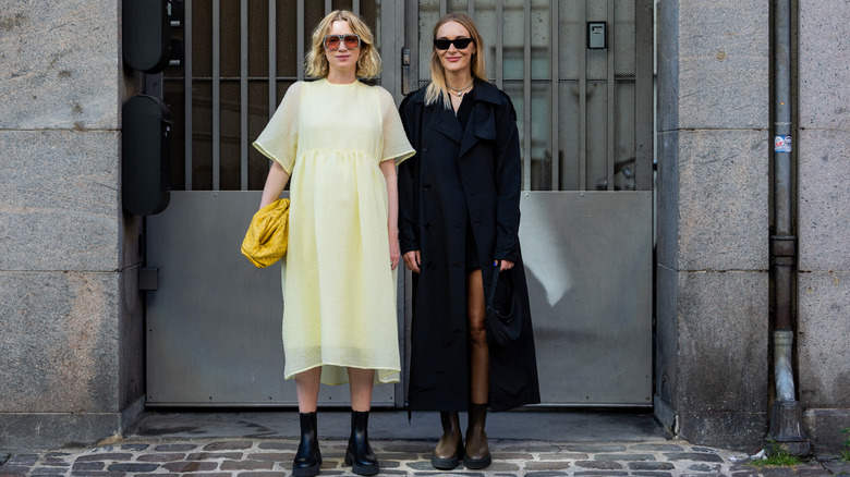 Women wear long dresses with boots