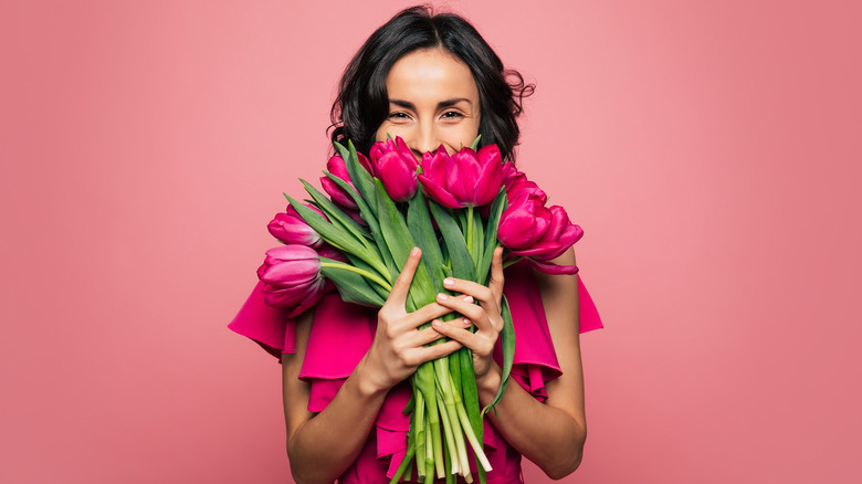 woman holding flowers