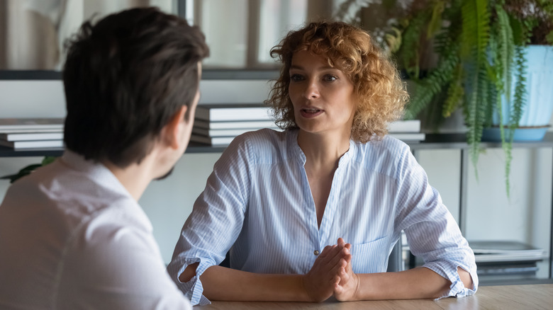 woman talking to colleague