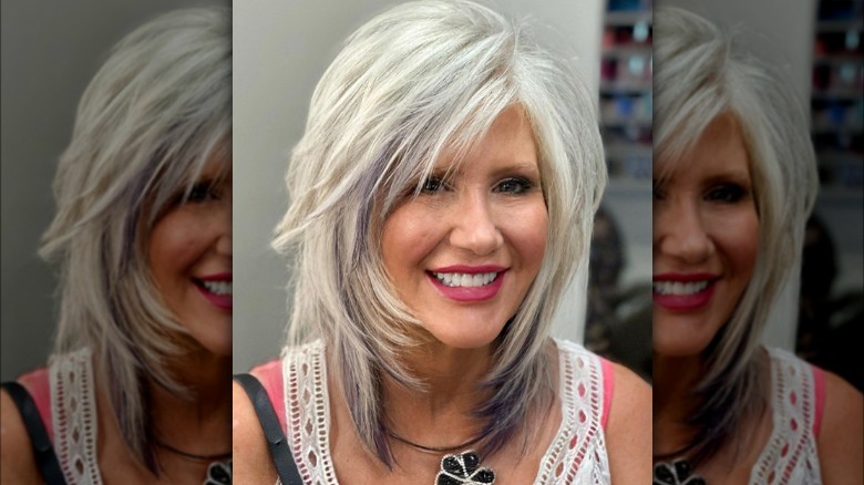 Older woman shows off new haircut