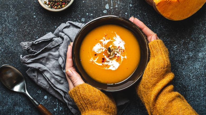 Woman holding soup bowl