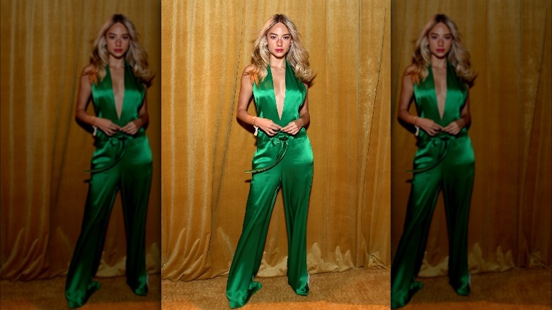 Woman in green halter jumpsuit 