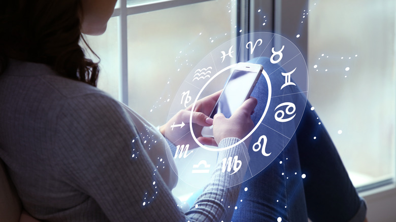 Woman using astrology app