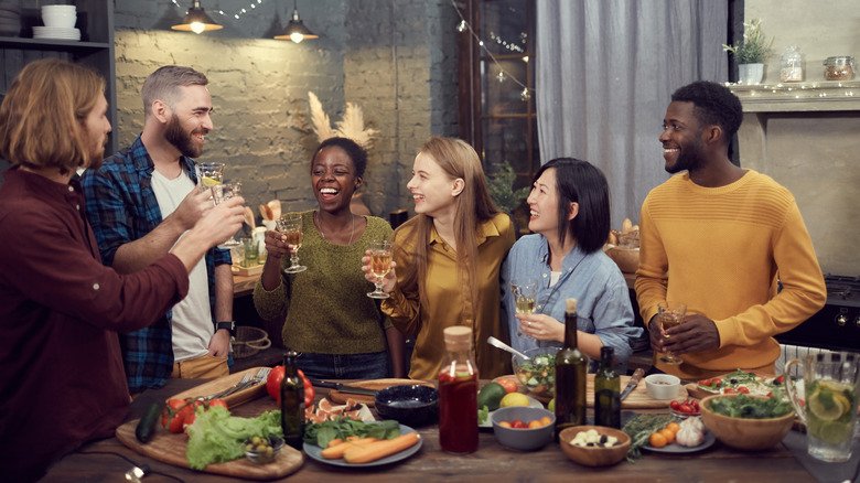 Friends laughing at dinner