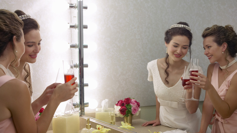 Friends talking on wedding day